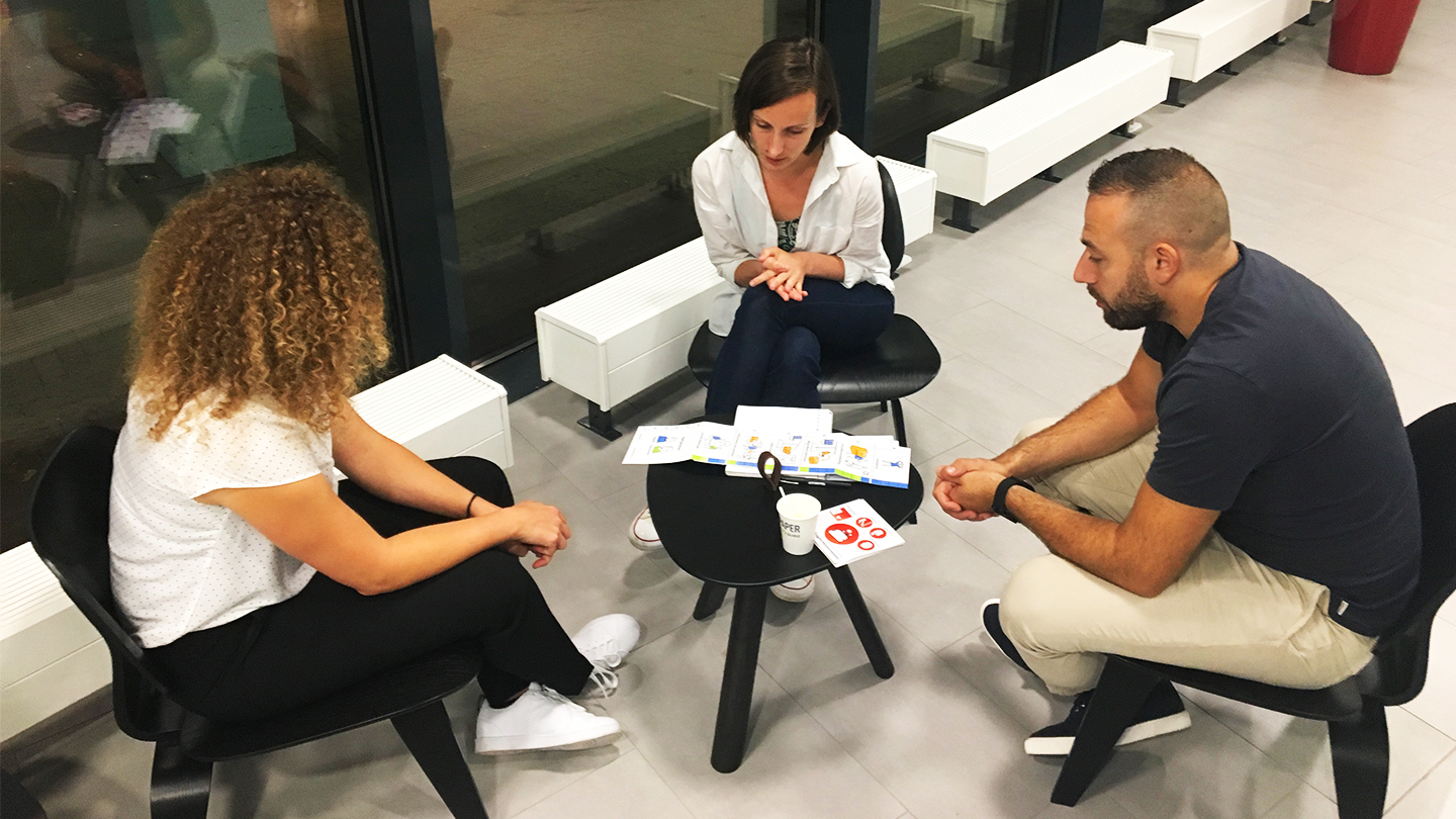 Debt counselors in a feedback session.